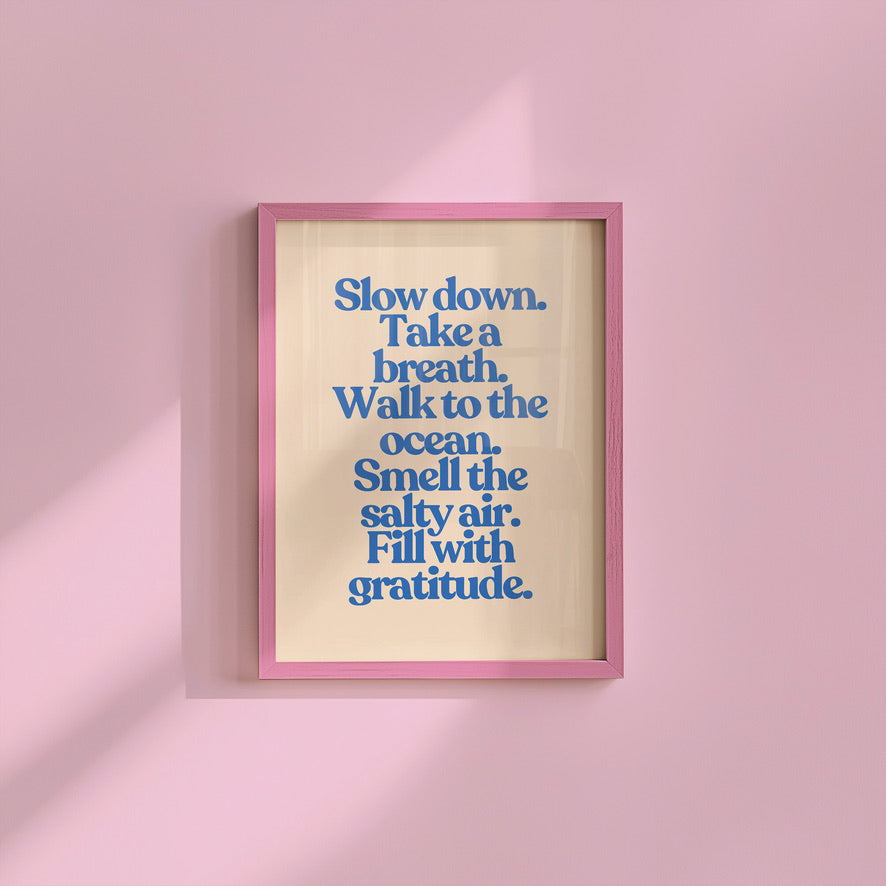 a pink frame hanging on a pink wall