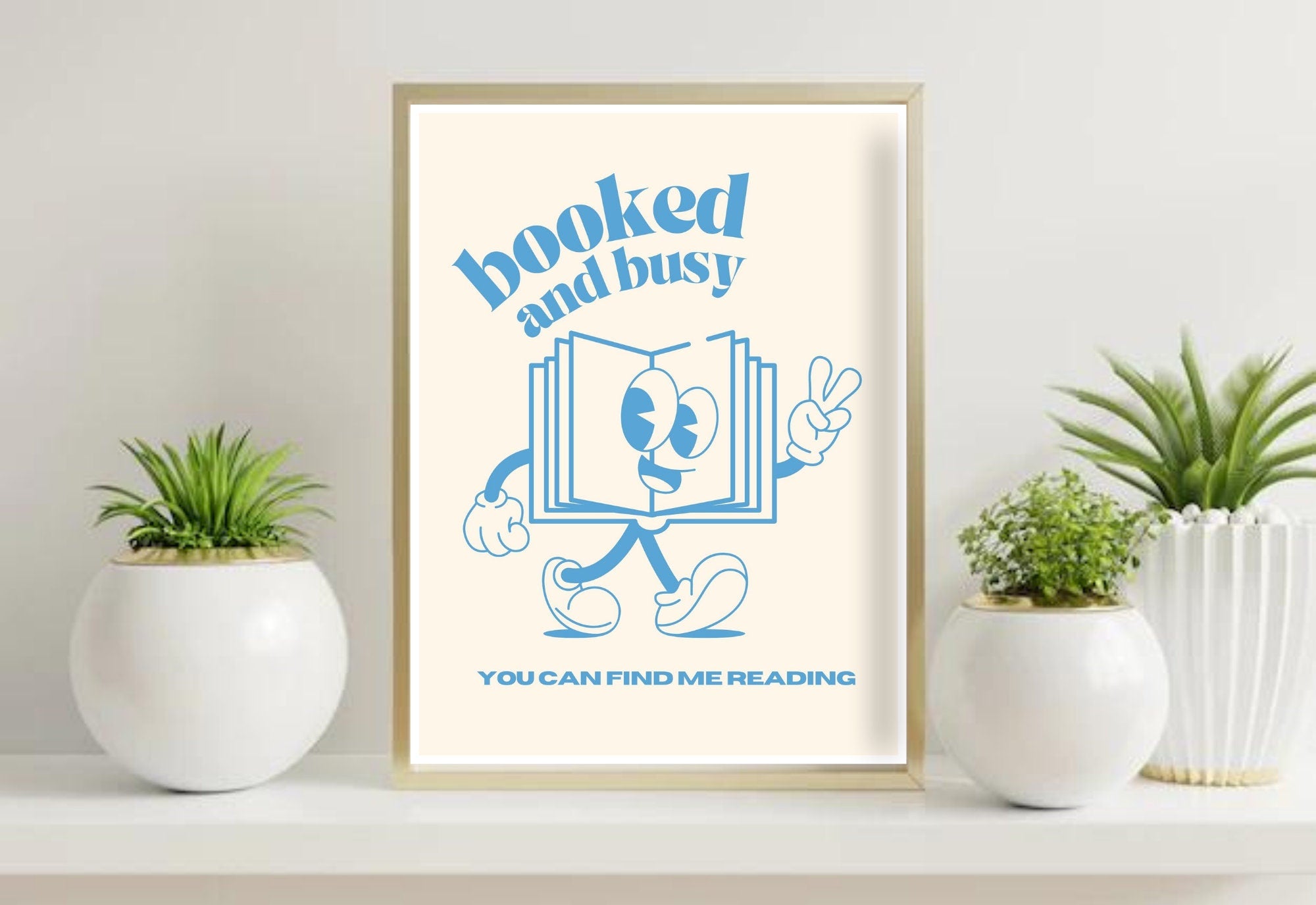 Booked and Busy Light Blue Digital Art Print featuring playful, retro typography in a light blue color scheme. This downloadable wall art is the perfect addition to any space, from your home office to your bedroom. Order yours today and start living your best booked and busy life!