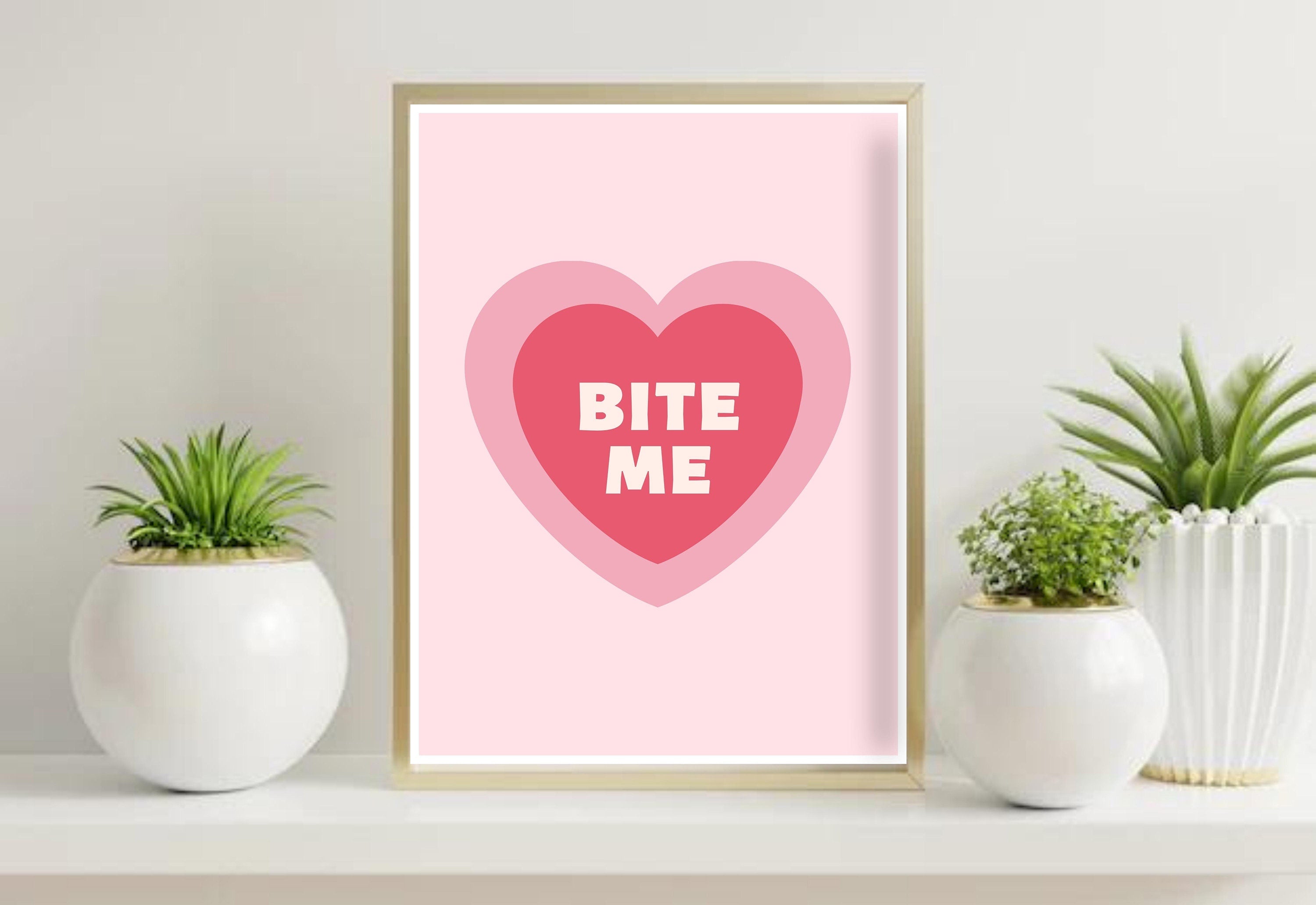 The 'Bite Me Art Print' displayed in a modern living room setting with vibrant colors.