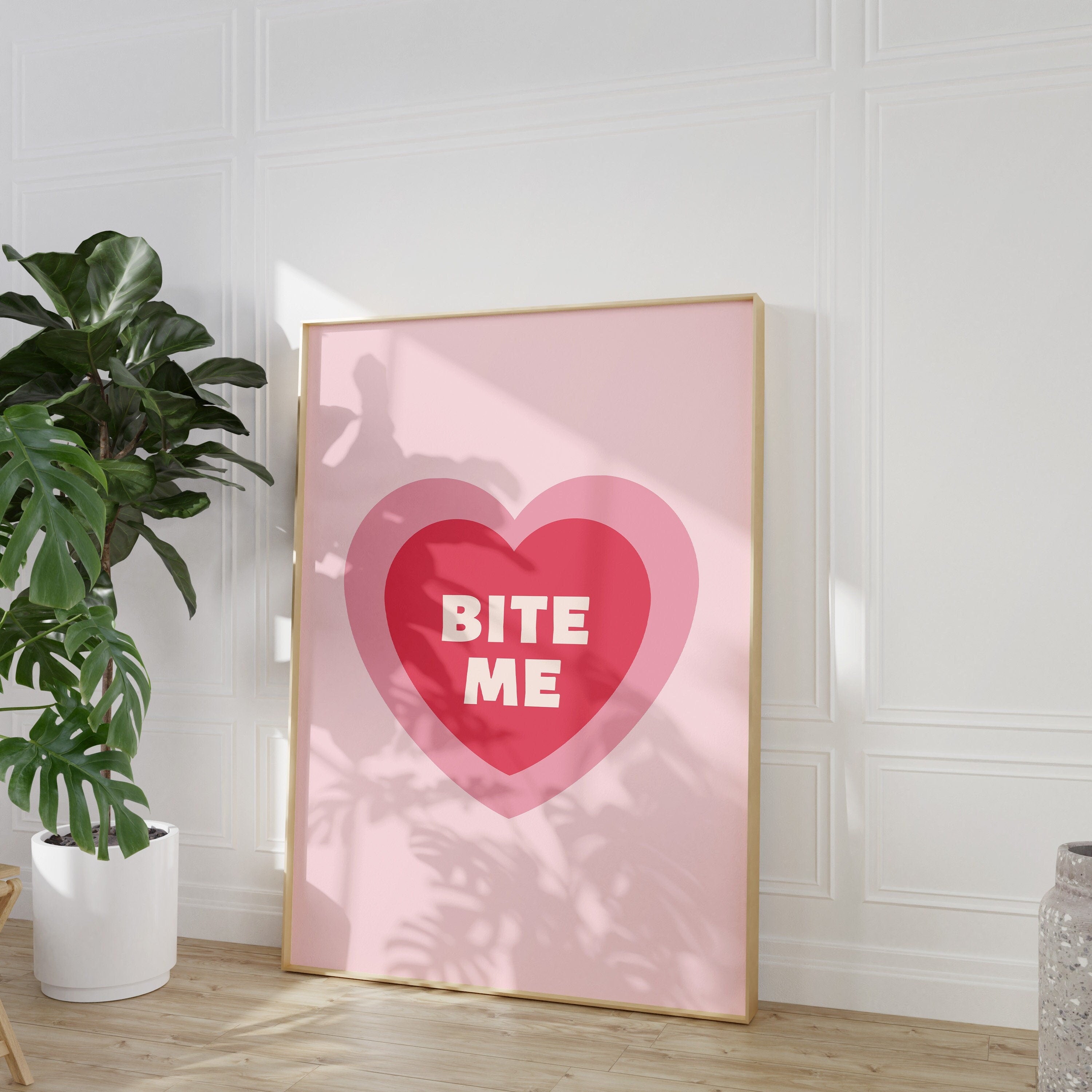 The 'Bite Me Art Print' displayed in a minimalist interior for a chic aesthetic.
