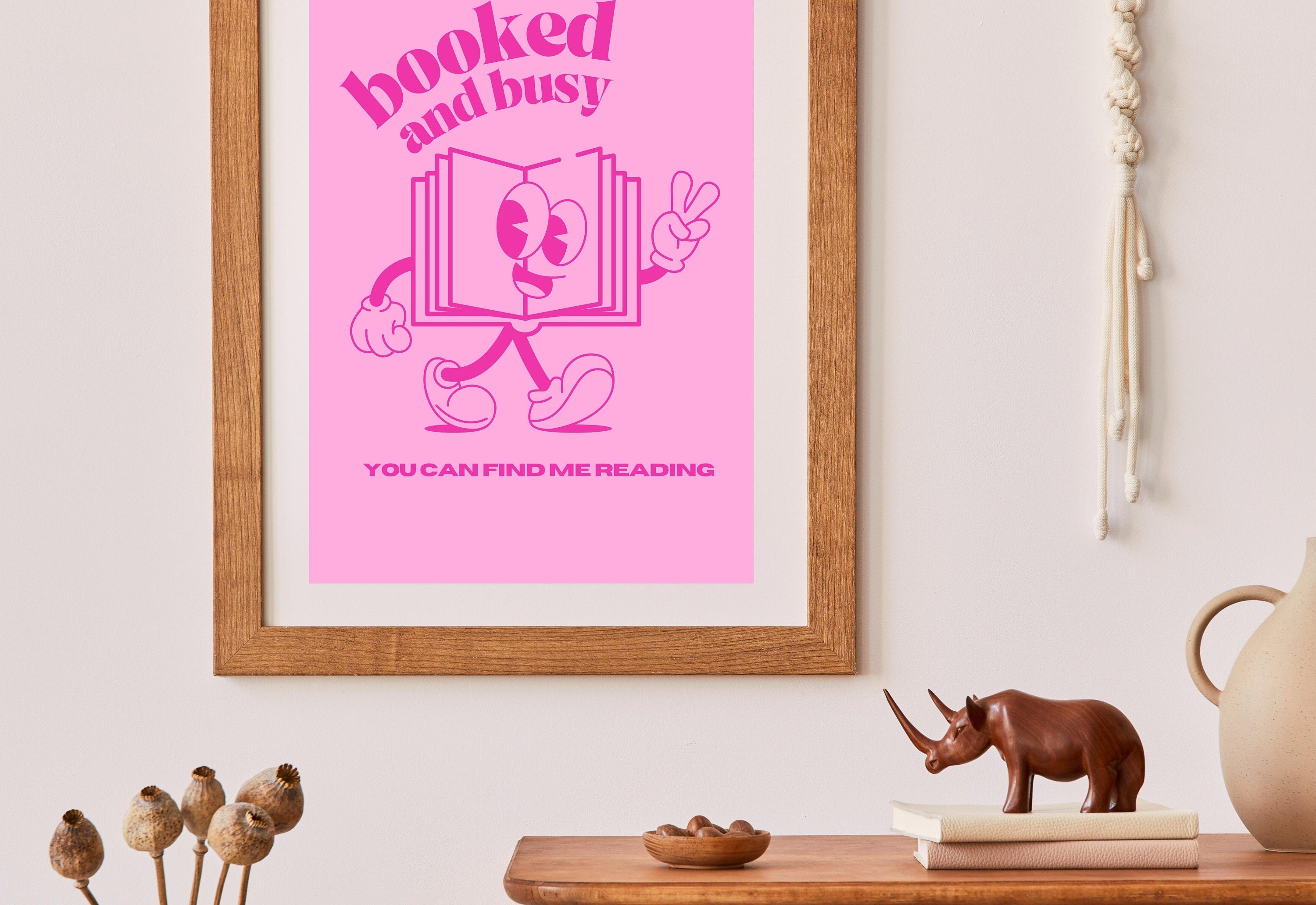 Eye-catching hot pink digital art print featuring the words "Booked and Busy"